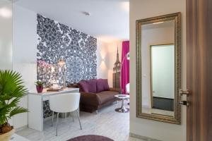 Posezení v ubytování Hotel l'adresse garni
