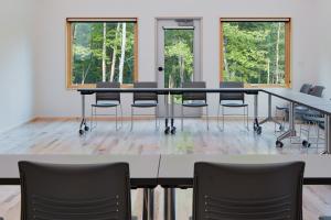 a conference room with a table and chairs at Wild Rice Retreat in Bayfield