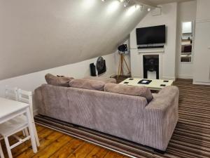 Кровать или кровати в номере The Loft Apartment