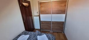 Posteľ alebo postele v izbe v ubytovaní Apartman for 4 Siófok
