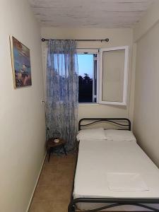 Ένα ή περισσότερα κρεβάτια σε δωμάτιο στο Elafonisos Guesthouse