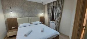 Postel nebo postele na pokoji v ubytování Hotel Visitor
