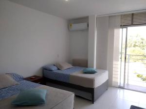 Postel nebo postele na pokoji v ubytování Condominio Terrazas del Sol