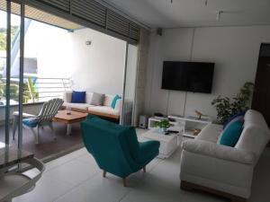 TV a/nebo společenská místnost v ubytování Condominio Terrazas del Sol