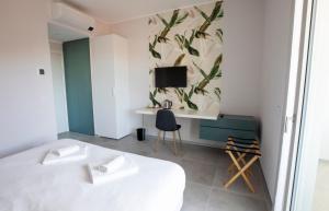 Postel nebo postele na pokoji v ubytování B&B Fior di Magnolia + 15 fotografií