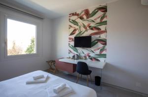 Postel nebo postele na pokoji v ubytování B&B Fior di Magnolia