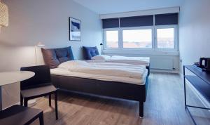 Tempat tidur dalam kamar di Harbour Living by Jutlandia