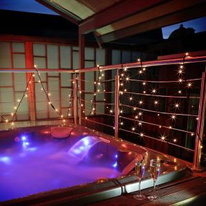 a large pool of water with lights on it at Karma Sanctum Soho Hotel in London