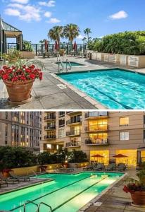 a large swimming pool in front of a building at Oceanfront lux condo in Long Beach