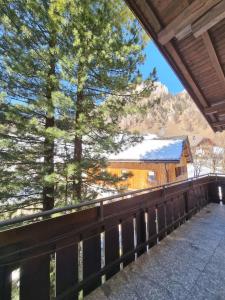 a view from the deck of a house with trees at Residence Riposo in Colfosco