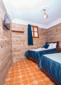Postel nebo postele na pokoji v ubytování Hotel Al kassaba