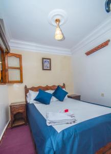 Postel nebo postele na pokoji v ubytování Hotel Al kassaba