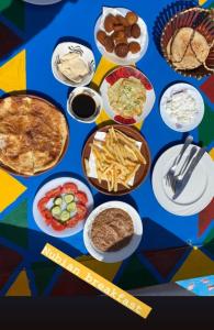 a table with plates of food on it at Lawanda Nubian House in Aswan