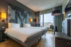 Postel nebo postele na pokoji v ubytování Radisson Blu Metropol Helsingborg
