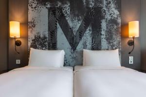 Postel nebo postele na pokoji v ubytování Radisson Blu Metropol Helsingborg