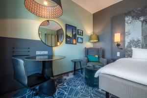 Postel nebo postele na pokoji v ubytování Radisson Blu Metropol Helsingborg