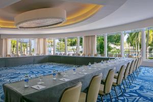 a long table in a room with windows at The Royal Sonesta San Juan in San Juan +111 photos