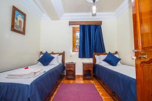 Postel nebo postele na pokoji v ubytování Hotel Al kassaba
