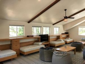 a living room with a couch and a tv at El Capitan Loft in Yosemite West