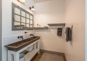 a bathroom with a sink and a mirror at El Capitan Loft in Yosemite West +17 photos