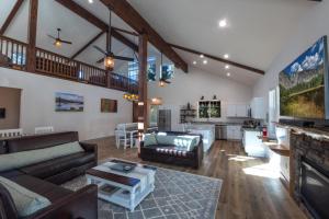 a large living room with a couch and a table at Half Dome Loft in Yosemite West