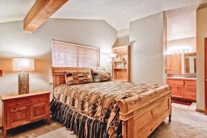 a bedroom with a large bed and a sink at Yosemite Crossroads in Yosemite West