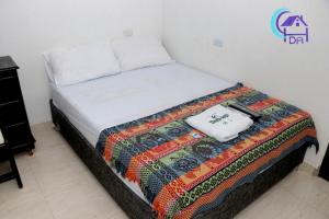Postel nebo postele na pokoji v ubytování HOTEL DOÑA ANA