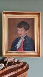 a painting of a boy in a suit and tie at Downtown - Jørgen Frantz - Marina in Tórshavn