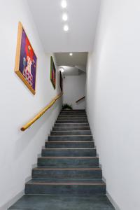 a staircase leading up to a building with a painting at TERRAVERA in Terrasini