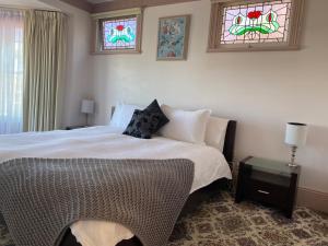 
a bedroom with a bed and a window at Gardenia House in Stanley
