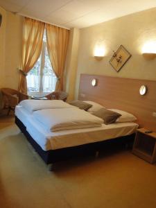 Postel nebo postele na pokoji v ubytování Parkhotel Villa des Effats Vielsalm