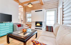 a living room with a couch and a fireplace at Nice Home In Bregana With House A Panoramic View in Bregana