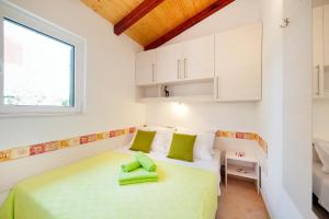 Postel nebo postele na pokoji v ubytování Apartments Sara