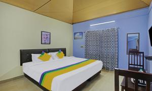 Кровать или кровати в номере Hotel Allaranda Homestay