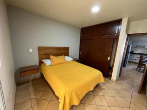 Postel nebo postele na pokoji v ubytování Departamento La Palma