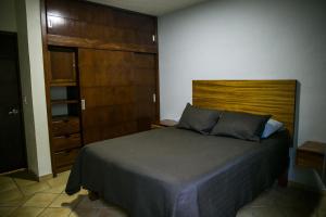 Postel nebo postele na pokoji v ubytování Departamento La Palma
