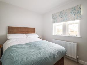 Un pat sau paturi într-o cameră la Wising Gill House