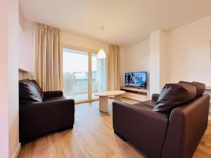 TV a/nebo společenská místnost v ubytování Sono Master Apartments