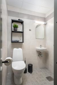 a bathroom with a toilet and a sink at Cosy Pepleri place in Tartu