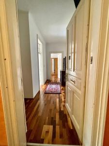 a hallway of a home with a hard wood floor at Downtown Chic Apartment Graz - Top 8 self check-in in Graz