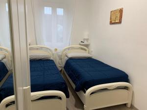 Postel nebo postele na pokoji v ubytování Ca' ToscaLina