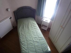 Rúm í herbergi á Le Château de Rendeux
