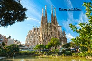 a view of the facade of the cathedral of barcelona at Suite Miro Charme et volupté in Perpignan