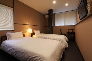 Cama o camas de una habitación en Villa Izumoya