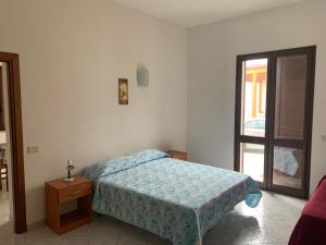 Postel nebo postele na pokoji v ubytování Casa Vacanze Mandriavecchia