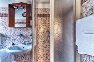 Koupelna v ubytování Hotel Portacavana
