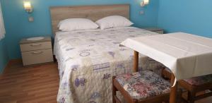 Postel nebo postele na pokoji v ubytování Apartments Rina