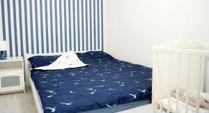 Posteľ alebo postele v izbe v ubytovaní Aura Apartament