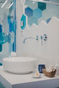 a bathroom with a white sink on a counter at Villa Nettuno in Positano