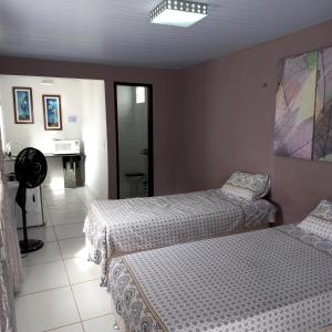 Cama o camas de una habitación en Natal Aconchegante